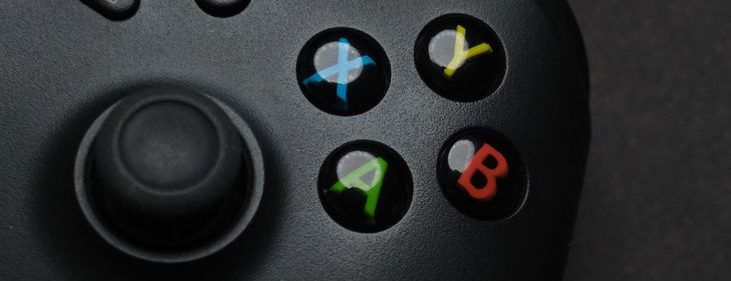black gaming controller on dark background
